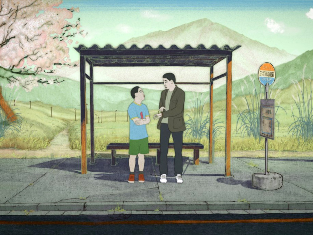 In a lush watercolour-painted landscape, an older man and a younger boy stand at a bus stop in front of a cherry tree and mountains.